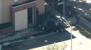 A police pursuit ended with a fiery crash in Whittier on Feb. 18, 2019, sending both a suspect and an uninvolved motorist to the hospital, officials said. (Credit: KTLA)