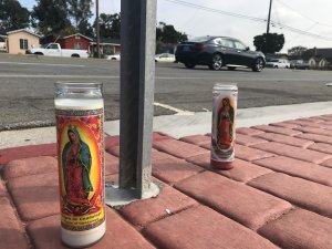 Mourners on March 27, 2019 left candles near the spot in Torrance where a 10-year-old boy was fatally struck by a pickup truck driver who swerved to avoid a dog. (Credit: KTLA)