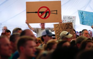 A man displays an anti gun violence sign during a March for our Lives Rally at Fairfield Hills Campus, in Newtown Connecticut on August 12, 2018. (Credit: KENA BETANCUR/AFP/Getty Images)