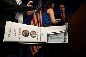 A California Department of Justice report on the Stephon Clark shooting sits on a table as Attorney General Xavier Becerra speaks to reporters on March 5, 2019, in Sacramento. (Credit: Justin Sullivan / Getty Images)