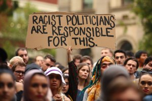 Protesters hold placards aloft as they march during the Stand Against Racism and Islamophobia: Fraser Anning Resign! rally on March 19, 2019, in Melbourne, Australia. (Credit: Scott Barbour/Getty Images)