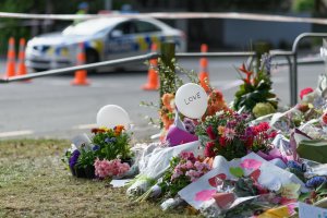 Flowers and condolences are seen in front of Al Noor mosque on March 20, 2019 in Christchurch, New Zealand. 50 people were killed, and dozens are still injured in hospital after a gunman opened fire on two Christchurch mosques on Friday, 15 March.  The accused attacker, 28-year-old Australian, Brenton Tarrant, has been charged with murder and remanded in custody until April 5. The attack is the worst mass shooting in New Zealand's history. (Credit: Kai Schwoerer/Getty Images)