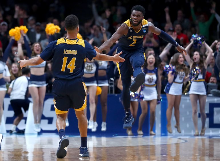 Evan Leonard #14 of the UC Irvine Anteaters celebrates a three-point shot with Max Hazzard #2 in the second half against the Kansas State Wildcats during the first round of the 2019 NCAA Men's Basketball Tournament at SAP Center on March 22, 2019, in San Jose. (Credit: Yong Teck Lim/Getty Images)