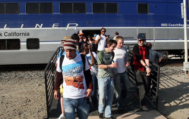 Festivalgoers exit the Coachella Express train arriving at the Coachella Valley Music and Arts Festival in Indio on April 24, 2008. (Credit: Matt Simmons / Getty Images)