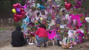 Mourners visit a memorial in Hacienda Heights on March 11, 2019, that was set up for a 9-year-old girl whose body was found in a suitcase on March 5, 2019. (Credit: KTLA)