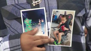 Oscar Ventura holds pictures of his son, Damien, taken two days before the boy died last July during a news conference announcing a lawsuit against Los Angeles County and its child services agency on March 1, 2019. (Credit: KTLA)