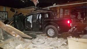 A pickup truck is seen inside the Party Doll bar in Highland on March 20, 2019. (Credit: KTLA)