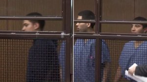 From left: Christian Reyes, Jesus Morales and Andrew Bran appear to be arraigned in a San Fernando courtroom on March 25, 2019. (Credit: KTLA)