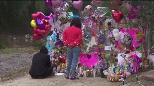 Family members of Trinity Love Jones pay their respects at the memorial near where her body was found in Hacienda Heights. (Credit: KTLA)