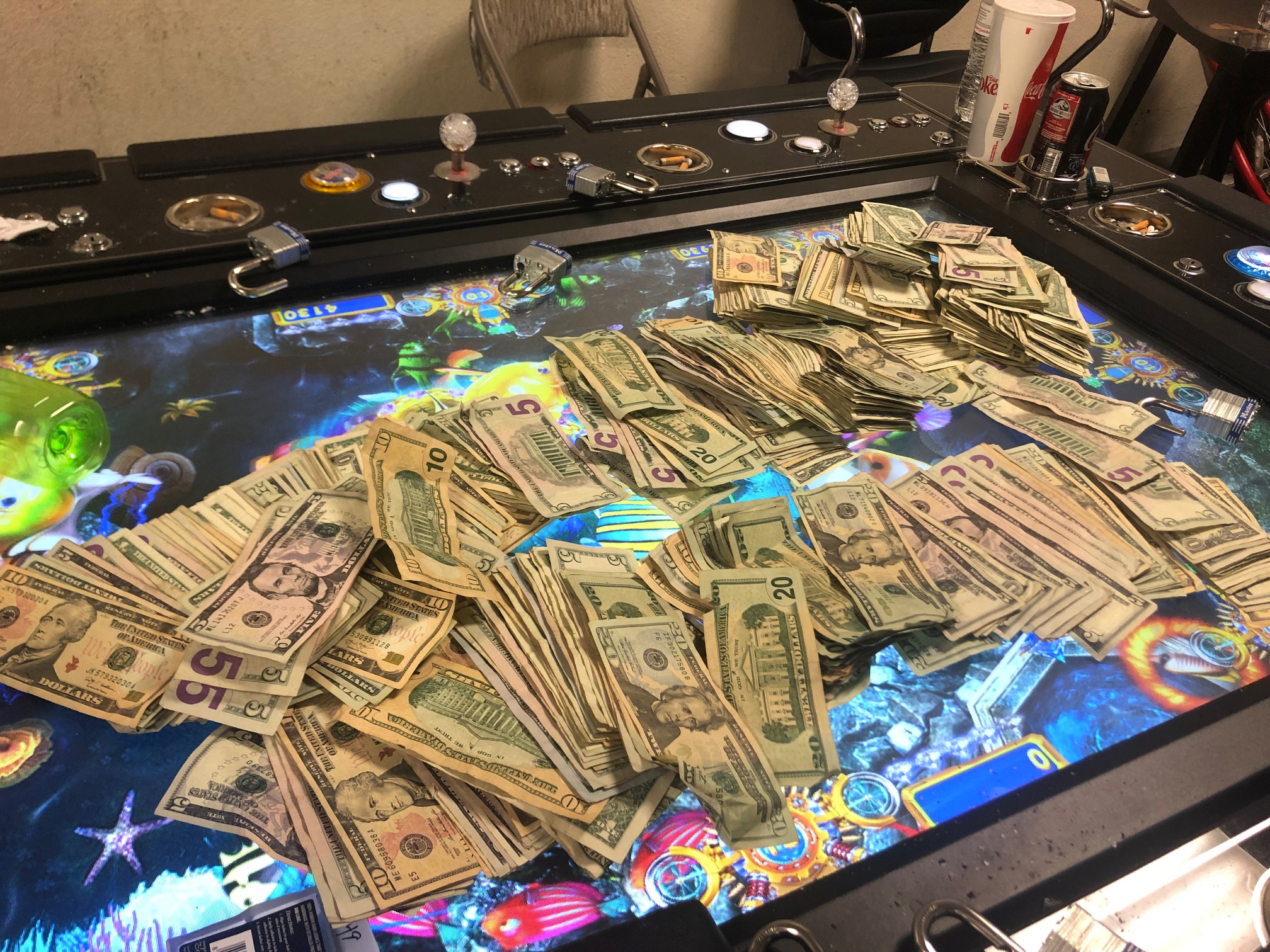 Cash is found during a raid at an alleged illegal gambling facility in Pomona. (Credit: Pomona Police Department)