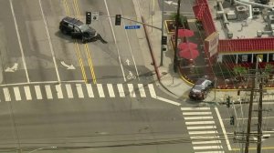 The driver of a stolen vehicle (left) was arrested after a passenger was killed in a Fullerton crash on April 1, 2019. (Credit: KTLA)