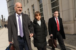 Actress Allison Mack leaves the Brooklyn Federal Courthouse with her lawyers after a court appearance surrounding the alleged sex cult NXIVM on Feb. 6, 2019. (Credit: Spencer Platt / Getty Images)