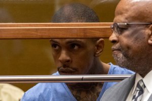 Eric Ronald Holder Jr., 29, who is accused of killing of rapper Nipsey Hussle, appears for arraignment in Los Angeles with his attorney Christopher Darden on April 4, 2019. (Credit: Patrick Fallon / Getty Images)