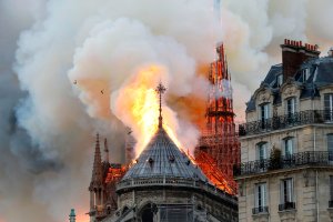 Smoke and flames rise during a fire at the landmark Notre-Dame Cathedral in central Paris on April 15, 2019, potentially involving renovation works being carried out at the site, the fire service said. (Credit: FRANCOIS GUILLOT/AFP/Getty Images)