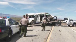 A travel van involved in a crash in Lancaster is towed from the scene April 6, 2019. (Credit: KTLA)