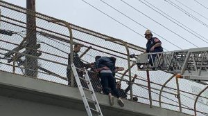 Alhambra police officers and firefighters rescued a suicidal woman from an overpass of the 10 Freeway in Alhambra on April 20, 2019. (Credit: Alhambra Fire Department)