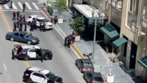 Los Angeles Police Department officers responding to the scene of an officer-involved-shooting in downtown Los Angeles on April 14, 2019. (Credit: Dennis Jaurigue)