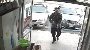A man was caught on camera firing a gun at a worker at a 99 cents store in Pomona on Dec. 2, 2018. (Credit: Pomona Police Department)