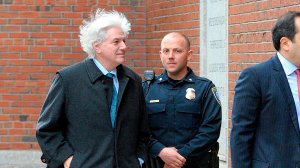 New York food and beverage distributor Gregory Abbott, left, makes his way to the John Joseph Moakley United States Courthouse to plea in front of a judge for charges in the college admissions scandal, on March 29, 2019, in Boston. (Credit: JOSEPH PREZIOSO/AFP/Getty Images)