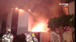 A fire burns at an apartment building in Anaheim as firefighters work to put out the flames May 26, 2019. (Credit: OC Hawk)