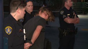 A man is arrested after allegedly pointing a bong from a hotel window in downtown San Diego, sparking concern among citizens who mistook it for a gun on May 8, 2019. (Credit: KSWB)