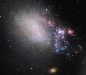 Two neighboring galaxies, NGC 4485 and NGC 4490, collided in the distant past, but we've only recently seen it for the first time. (Credit: ESA/Hubble/NASA)