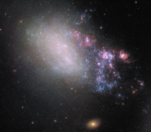 Two neighboring galaxies, NGC 4485 and NGC 4490, collided in the distant past, but we've only recently seen it for the first time. (Credit: ESA/Hubble/NASA) 