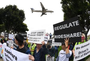 Drivers for Uber and Lyft stage a strike at Los Angeles International Airport over what they say are unfair wages on May 8, 2019. (Credit: Mark Ralston / AFP / Getty Images)