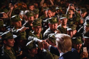 President Donald Trump greets Marines aboard the amphibious assault ship USS Wasp during a Memorial Day event in Yokosuka, Japan, on May 28, 2019. (Credit: Brendan Smialowski / AFP / Getty Images)