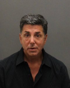 Richard Bloustine, 53, is seen in a May 1, 2019, booking photo released by the Laguna Beach Police Department.