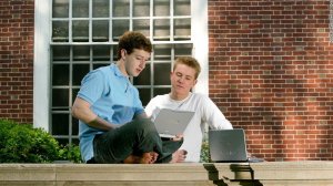 Chris Hughes is seen with Mark Zuckerberg in this undated photo obtained by CNN. Hughes helped transform Facebook from a dorm-room project into a real business. Now, he's calling for the company to be broken up.