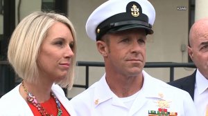 Navy Special Operations Chief Edward Gallagher, right, stands alongside his wife, Andrea Gallagher, after being released for custody on May 30, 2019 in San Diego. (Credit: KSWB via CNN)