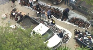 ATF officials investigate after hundreds of guns are found in a Bel-Air home on May 8, 2019. (Credit: KTLA)