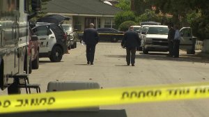 Authorities investigate the death of a 76-year-old woman found in her Arcadia backyard on April 9, 2019. (Credit: KTLA)