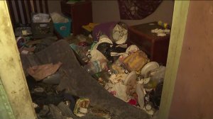 Trash covering a room in the Vermont-Slauson building where 40 people were evacuated on June 21, 2019. (Credit: KTLA)