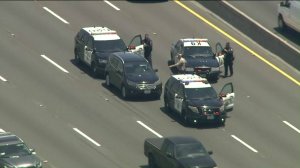 CHP officials box in a driver along the westbound 101 Freeway who was eluding authorities on several highways on June 12, 2019. (Credit: KTLA)