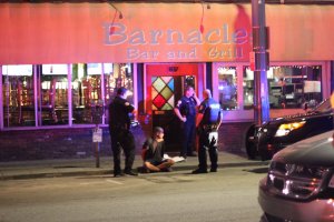 A man is detained near the scene of the blaze in a photo provided to KTLA by Kyle Simpson on June 13, 2019.