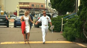 Navy Special Operations Chief Edward Gallagher, right, is accompanied by his wife, Andrea Gallagher, while arriving at military court on Naval Base San Diego on June 19, 2019. (Credit: CNN)