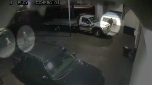Two suspects, including one who appears to be a child, are pictured in the left side of this surveillance camera image that captured portions of the fatal June 28, 2012, shooting of tow truck driver Robert Garcia, 22, of Norwalk. The victim, Garcia, is pictured at top right. (Credit: Los Angeles County Sheriff's Department)