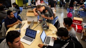 Nicholi Pietrzykowski of Cudahy, center, tinkers with a group project in Mario Ibarra's class at STEAM Legacy High School in 2019. The campus' resources are an outlier in cash-strapped L.A. Unified. (Credit: Kent Nishimura / Los Angeles Times)