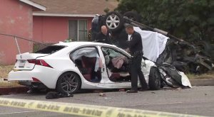 Officials assess the scene of a deadly crash in North Hills on June 16, 2019. (Credit: KTLA)