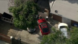 A Los Angeles County Sheriff's Department SWAT team deals with an armed, barricaded suspect in San Gabriel on June 6, 2019.