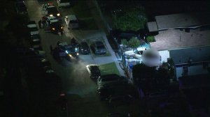 Aerial video from Sky5 captured a tense standoff between Los Angeles police and a gunman in Watts on April 30, 2019. (Credit: KTLA)