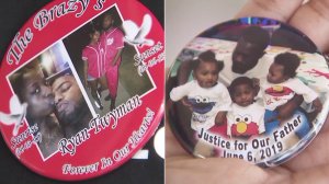 Pins worn by the girlfriend of Ryan Twyman commemorating the unarmed father who was fatally shot by deputies in Willowbrook are seen on June 14, 2019. (Credit: KTLA)