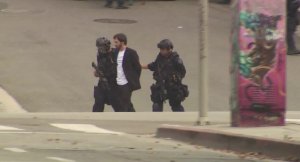 Authorities detain Robert Camou after an hourslong standoff in downtown Los Angeles on July 30, 2019. (Credit: KTLA)