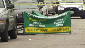 A body was found on a street in Compton following a shootout on July 3, 2019. (Credit: KTLA)