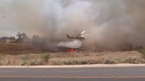 A helicopter drops water on the Star fire in Chino Hills on July 28, 2019. (Credit: KTLA)