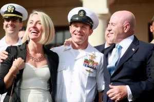 Navy Special Operations Chief Edward Gallagher celebrates with his wife Andrea after being acquitted of premeditated murder at Naval Base San Diego July 2, 2019, in San Diego. (Credit: Sandy Huffaker/Getty Images)