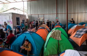 Tents are piled up in a hangar at Juventud 2000 migrant shelter in Tijuana, Baja California state, Mexico on July 13, 2019. (Credit: EDUARDO JARAMILLO CASTRO/AFP/Getty Images)
