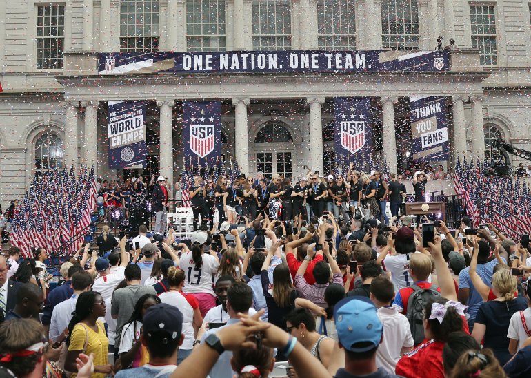 Members of the United States Women's National Soccer Team are honored at a ceremony at City Hall on July 10, 2019, in New York City. The honor followed a ticker tape parade up lower Manhattan's "Canyon of Heroes" to celebrate their gold medal victory in the 2019 Women's World Cup in France. (Credit: Bruce Bennett/Getty Images)